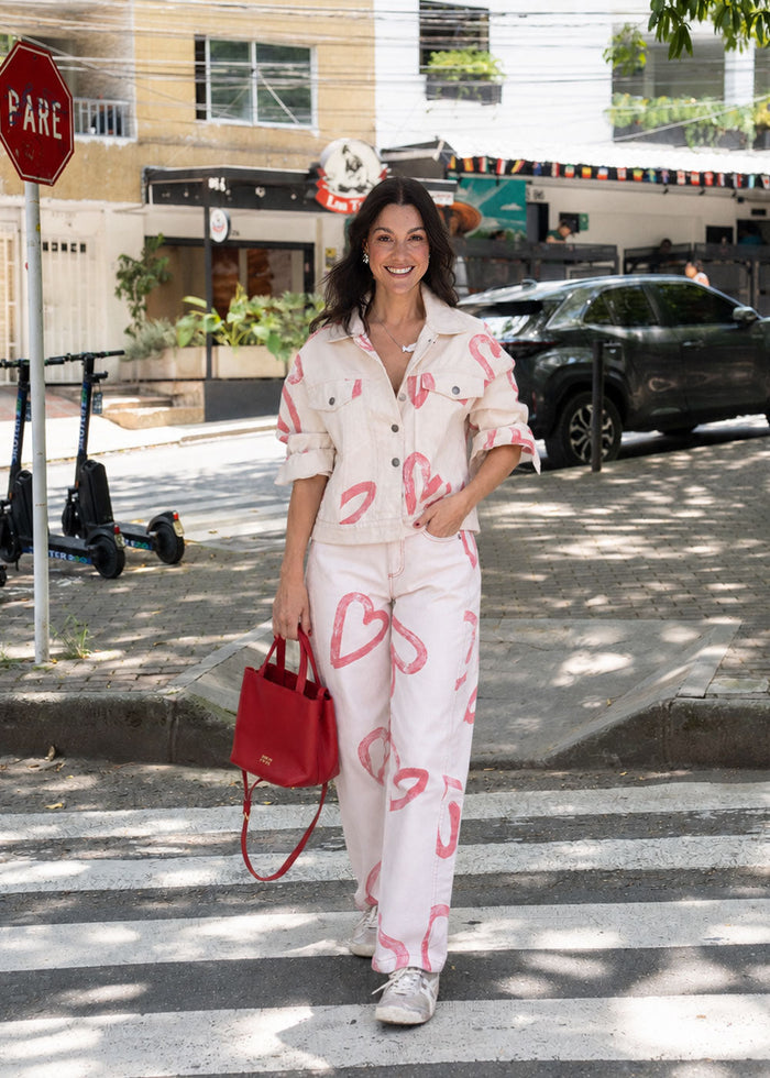 Ivory cotton drill jean with all-over red heart print, wide leg, side cuts, and knee darts, view 3