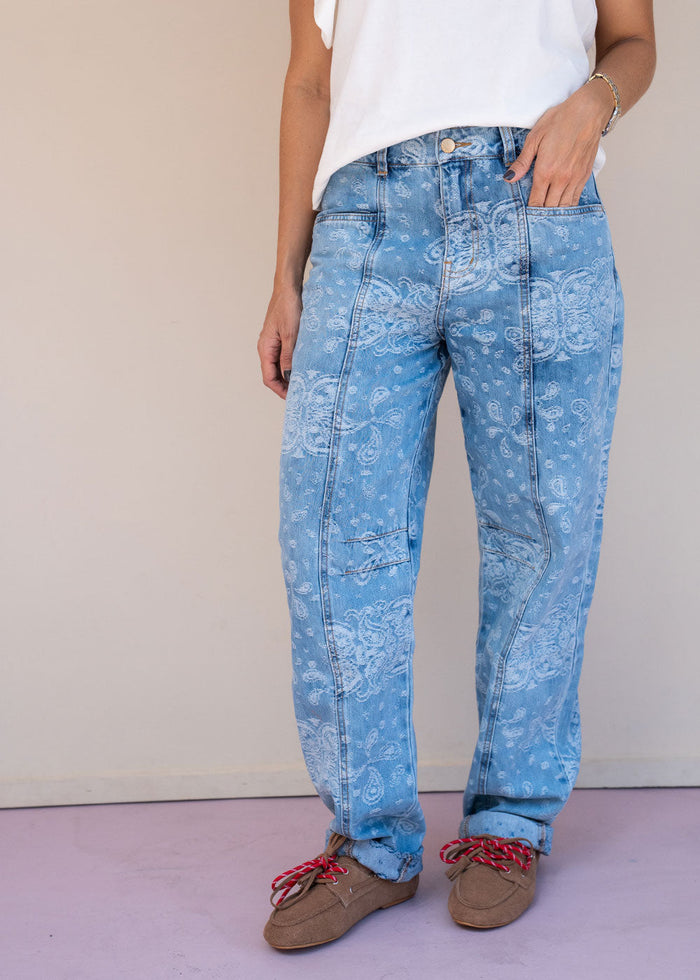 Indigo cotton drill jean with paisley print, barrel leg, and patch back pockets