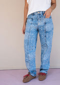 Indigo cotton drill jean with paisley print, barrel leg, and patch back pockets