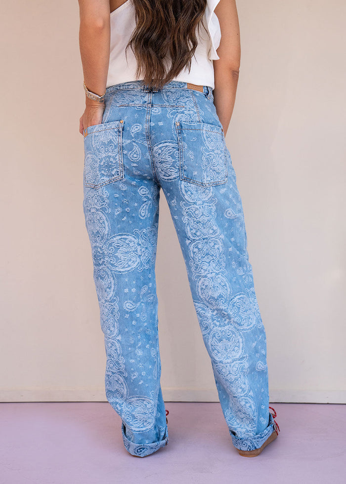 Indigo cotton drill jean with paisley print, barrel leg, and patch back pockets, view 3