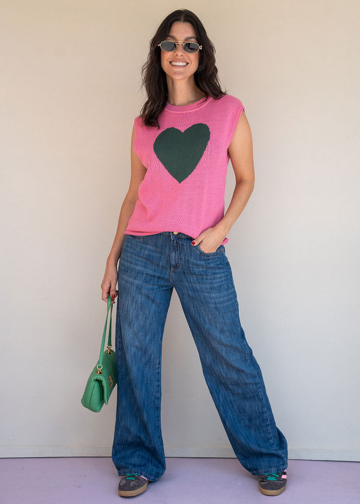 Pink acrylic knit vest with round neck and contrast green heart motif at the chest, view 4