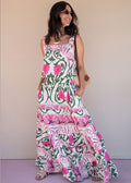Ivory printed rayon maxi dress with wide straps, elastic waist, and ruffled hem