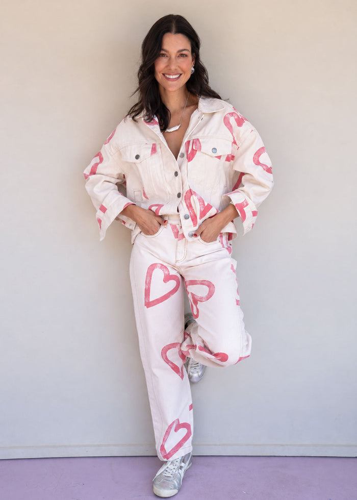 Ivory cotton drill denim jacket with all-over red heart print, front pockets, and barrel sleeves, view 5