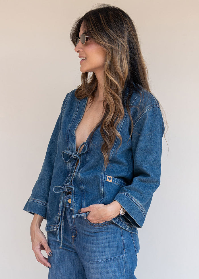 Indigo denim jacket with tie-front neckline, functional pockets, and 3/4 sleeves, view 7