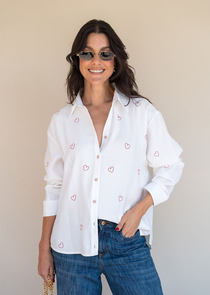 Ivory viscose challis shirt with red heart embroidery, band collar, and buttoned cuffs